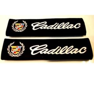 Two black Cadillac seat belt covers velcro closure.  Other cars are available